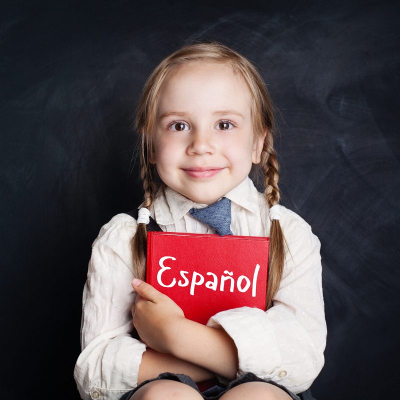 Kid,Learning,Spanish.,Little,Girl,With,Spanish,Book